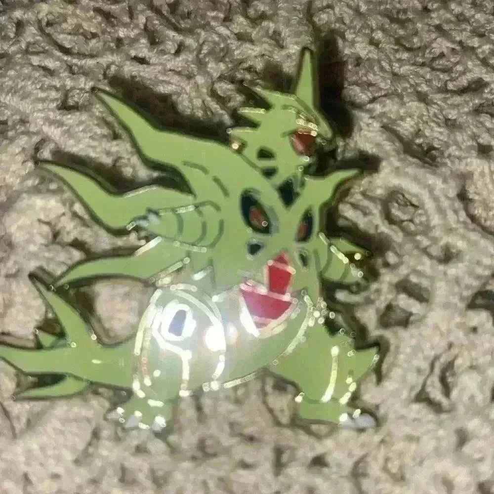 Novelty pin lot, including 1 Pokémon pin